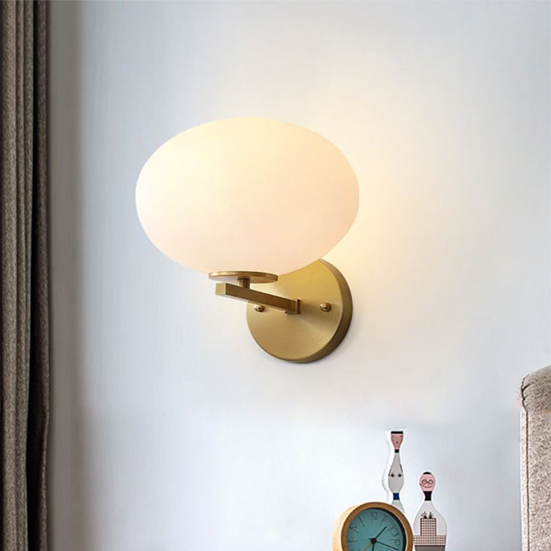 Milk Glass Oval Wall Mount Lamp Modern 1 Light Bedside Wall Sconce Light in Brass