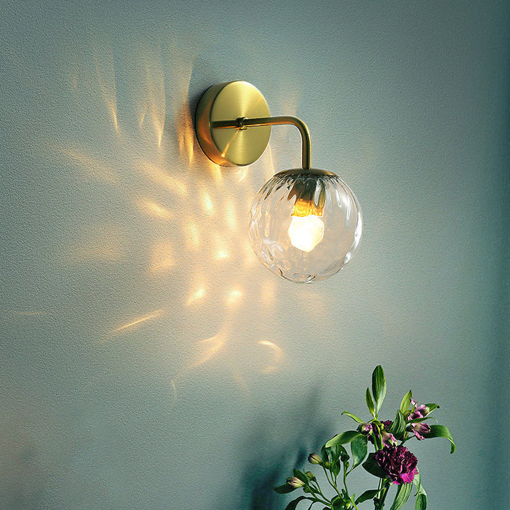 Ball Shaped Wall Lamp Minimalist Clear Rippling Glass 1-Light Bedroom Wall Mounted Lighting with Bent Arm in Black/Gold