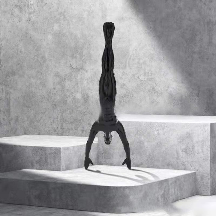 Climbing wall hanging statues