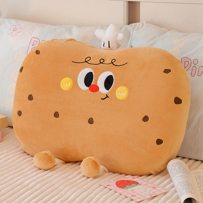 Plush pillow in cookie shape with cute face