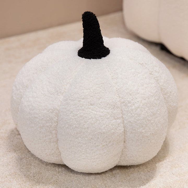 Plush cushion in pumpkin design
