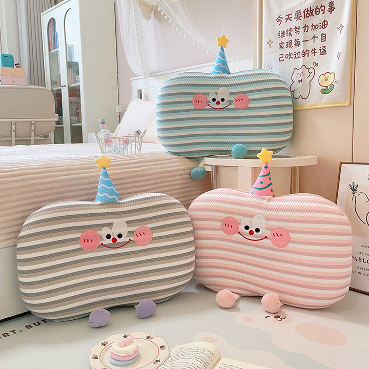 Plush pillow in cookie shape with cute face