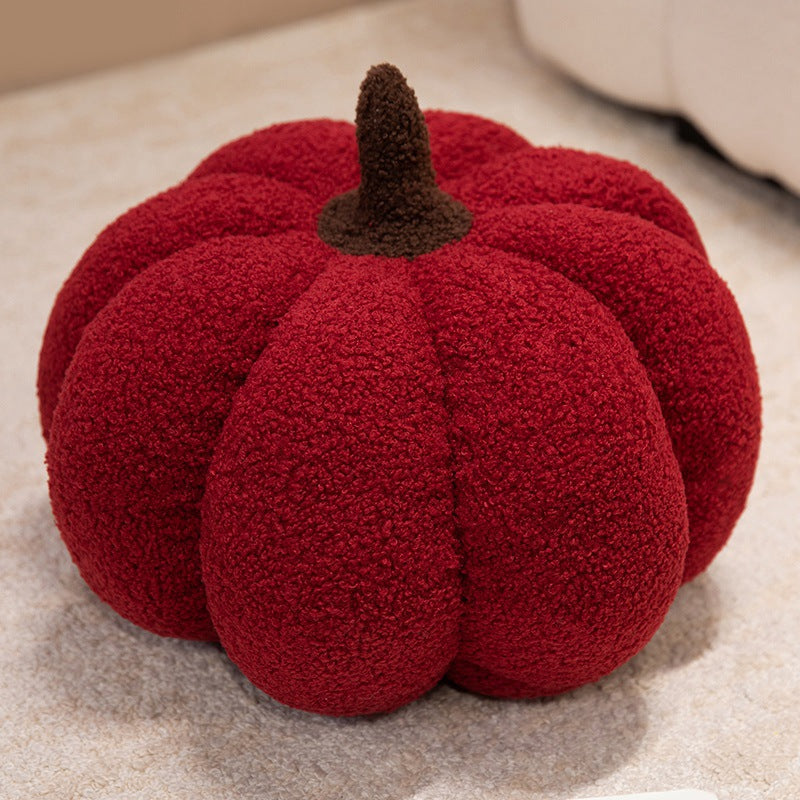 Plush cushion in pumpkin design