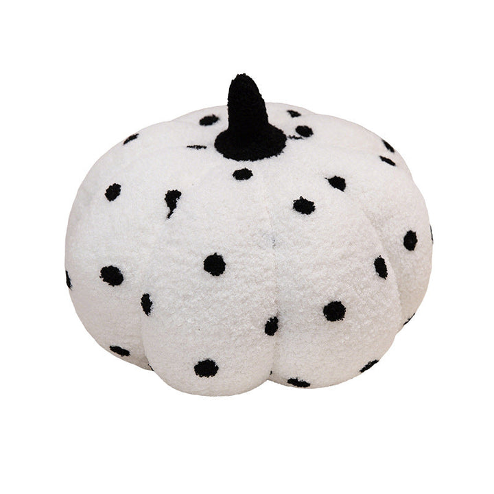 Plush cushion in pumpkin design