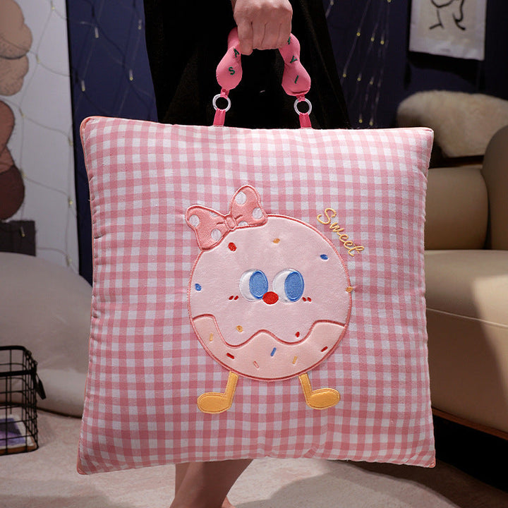 Plush cushion with candy motif