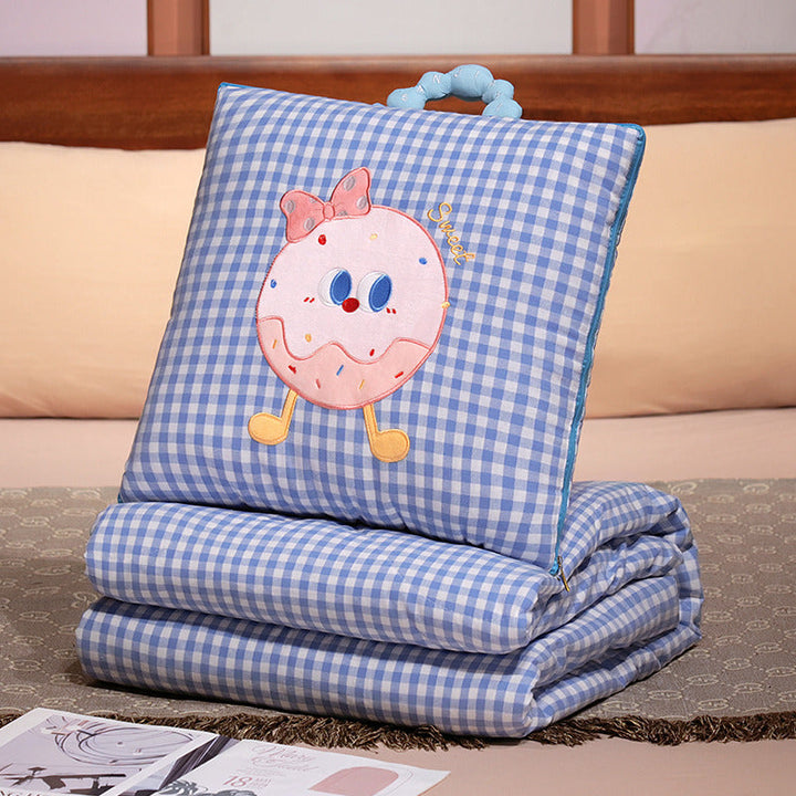 Plush cushion with candy motif