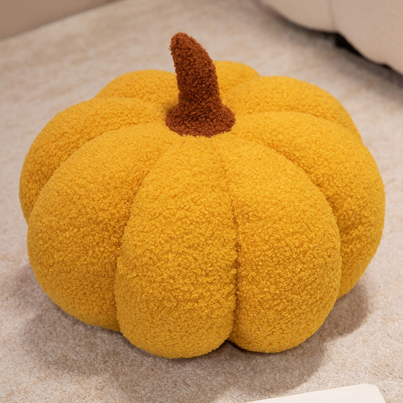 Plush cushion in pumpkin design