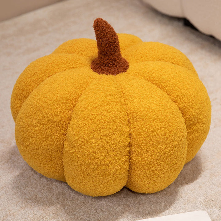 Plush cushion in pumpkin design