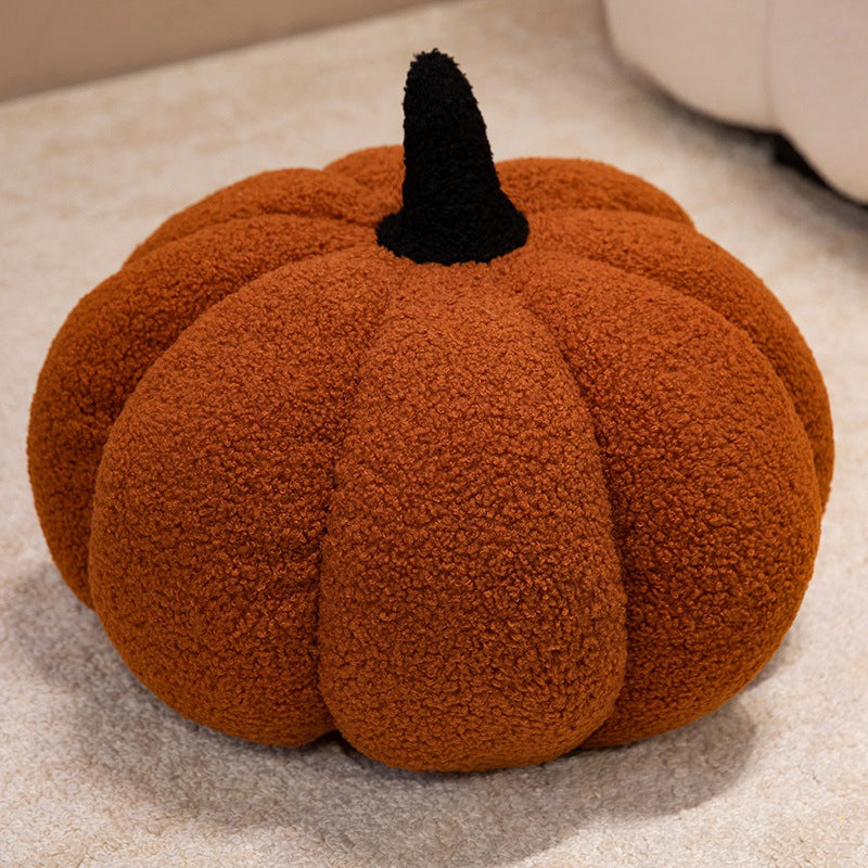 Plush cushion in pumpkin design