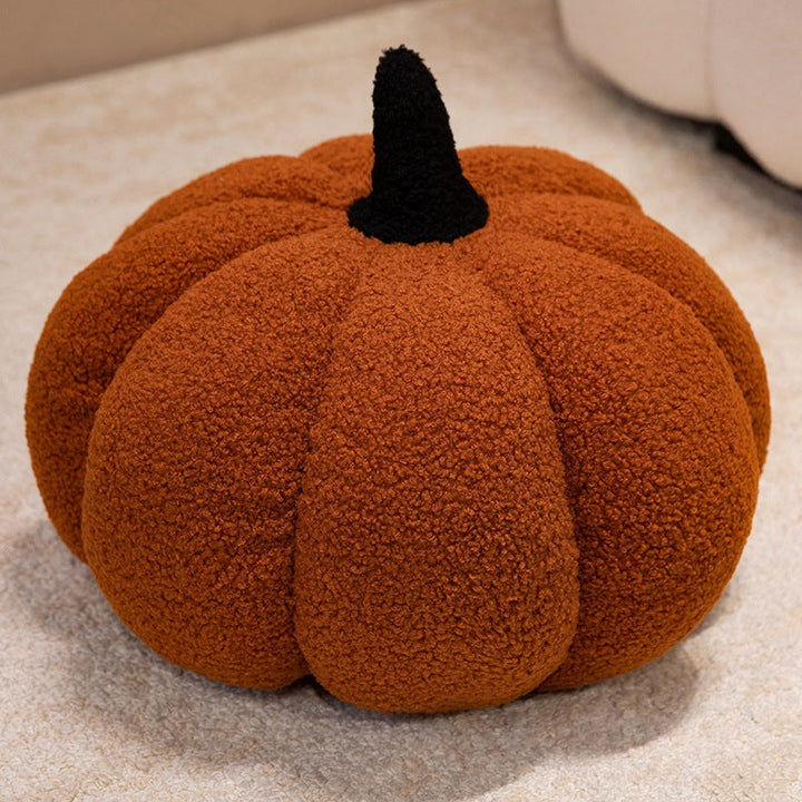 Plush cushion in pumpkin design