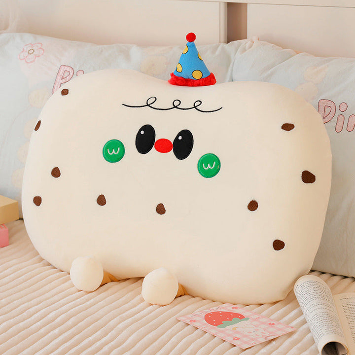 Plush pillow in cookie shape with cute face