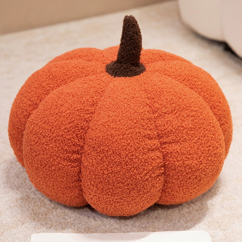 Plush cushion in pumpkin design