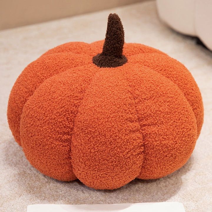 Plush cushion in pumpkin design