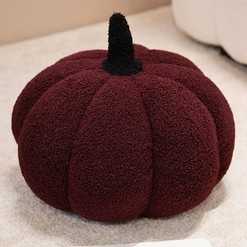 Plush cushion in pumpkin design