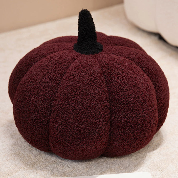 Plush cushion in pumpkin design