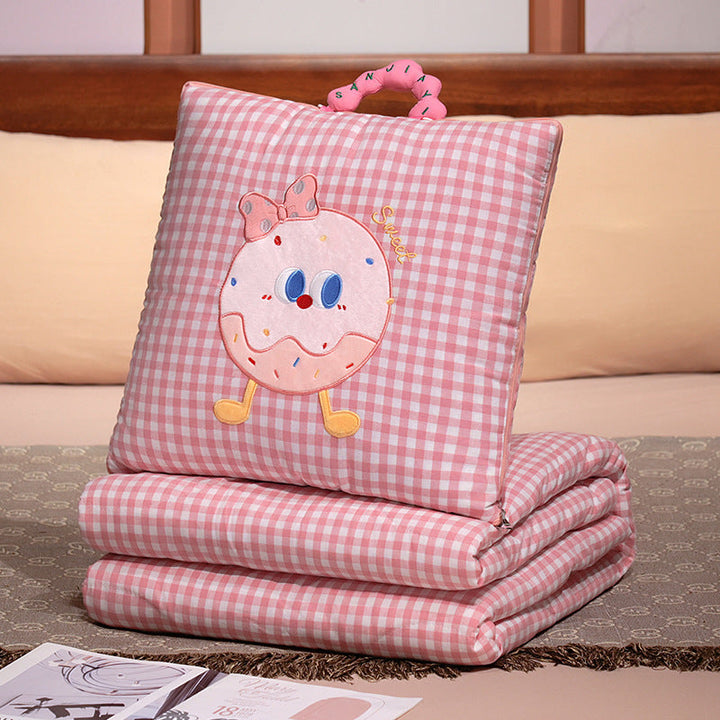 Plush cushion with candy motif