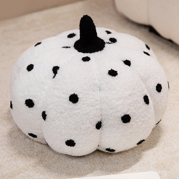 Plush cushion in pumpkin design