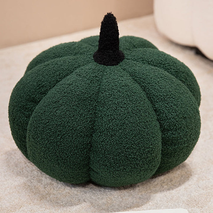 Plush cushion in pumpkin design