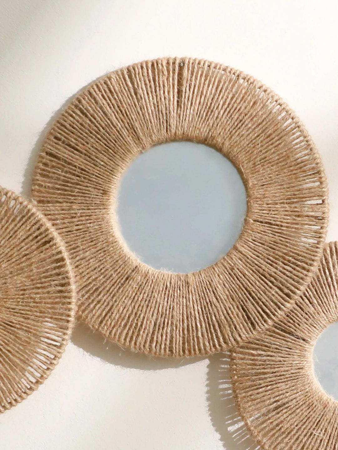 Round decorative wall mirror in boho style