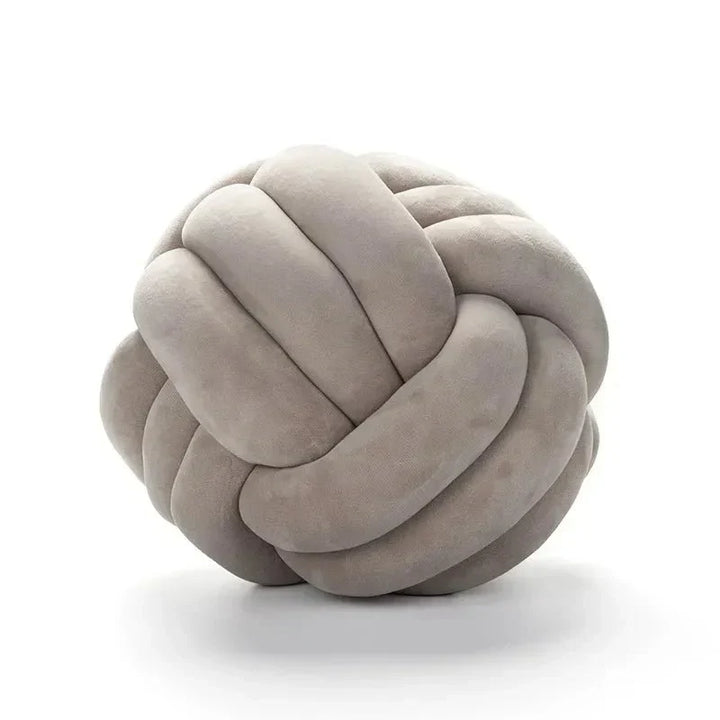Decorative, soft cushion with knotted ball in suede look