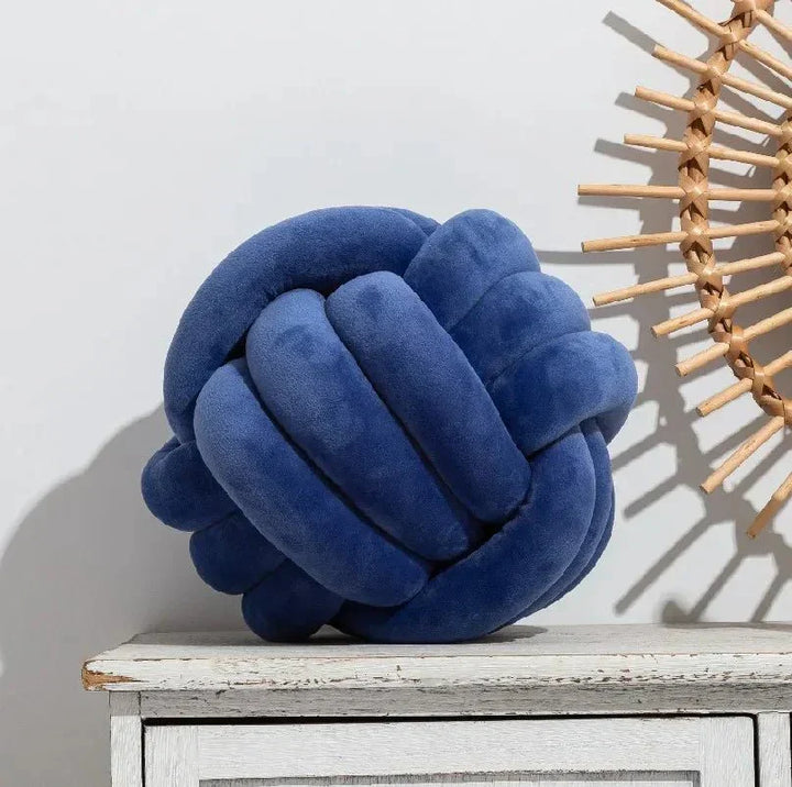 Decorative, soft cushion with knotted ball in suede look